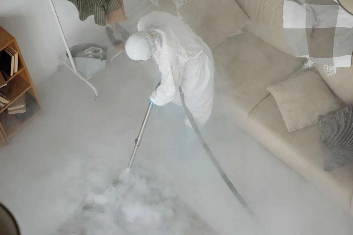 Biohazard cleanup technician in protective equipment, East Grand Forks, MN
